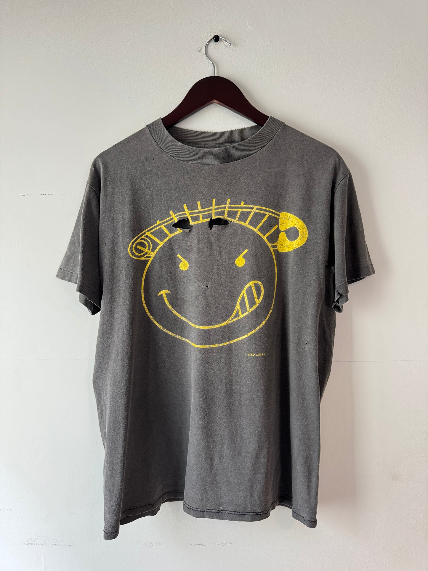 90s Wild Oats Smiley Faded Black Tee (L/XL)